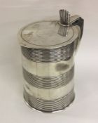 A large tapering Georgian silver lidded tankard of