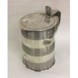 A large tapering Georgian silver lidded tankard of