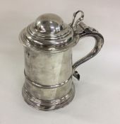 A heavy George II silver lidded tankard with taper