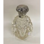 A hobnail cut silver topped scent bottle with embo