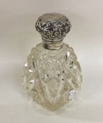 A hobnail cut silver topped scent bottle with embo