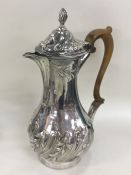 A large heavy Georgian silver ewer of half fluted