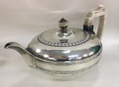 A good heavy circular Georgian silver teapot. Lond