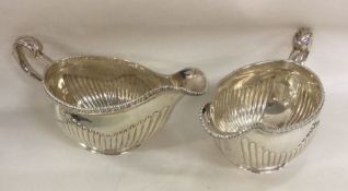 A good pair of Georgian silver sauce boats with fl