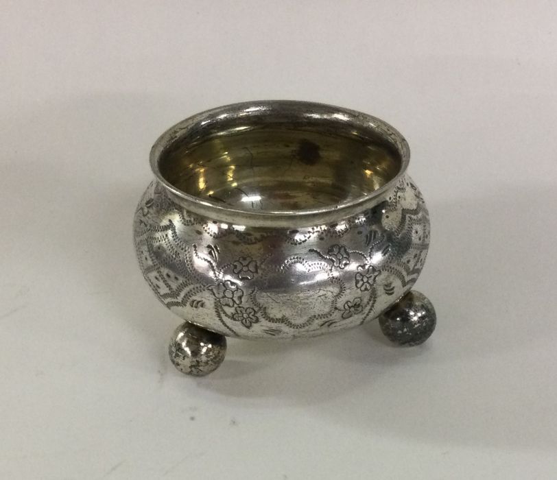 A Russian silver salt engraved with flowers to bal