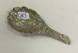 A modern cast silver eagle wing caddy spoon. Londo