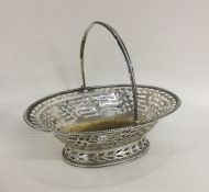 A George III pierced silver basket on pedestal bas