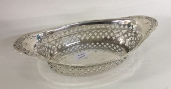 An attractive silver pierced boast shaped dish wit