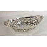 An attractive silver pierced boast shaped dish wit