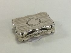 A rectangular engine turned silver vinaigrette wit