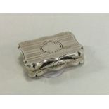 A rectangular engine turned silver vinaigrette wit