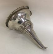 A Georgian silver wine funnel with gadroon rim to