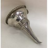 A Georgian silver wine funnel with gadroon rim to