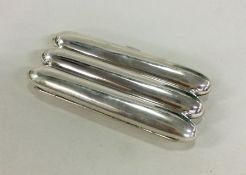 A large three finger silver cigar case with concea