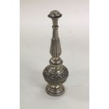 An Antique silver pepper chased with flowers and l