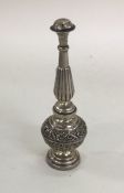 An Antique silver pepper chased with flowers and l