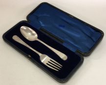 A cased two piece silver christening set with engr