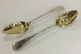 A good pair of George III silver berry spoons with