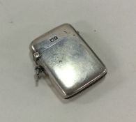 A plain rectangular silver vesta case with hinged