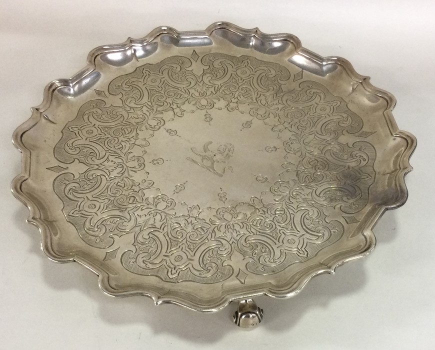 A heavy George III silver salver with engraved dec