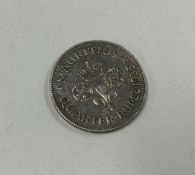 A silver Mauritius Quarter Rupee dated 1935.