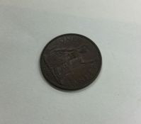 A 1944 George V Penny (good).