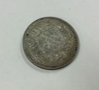 A George VI 1 Rupee dated 1942.