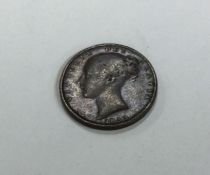 A Victorian Farthing dated 1853.