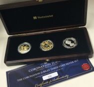 A boxed 'The Coronation Jubilee Three Coin Silver