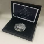 A Queen Elizabeth II Proof silver 5 oz £10 coin.