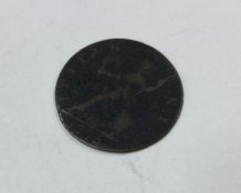 A George III Farthing dated 1775.
