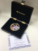 A commemorative boxed Prince George gold plated P