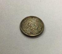 A Netherlands 25 Cents coin dated 1944.