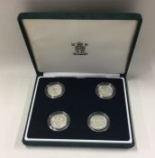 A boxed 2001 Proof silver £1 Millennium coin set.