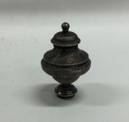 An early 19th Century screw top silver vinaigrette