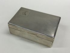 A clean, crisp silver cigarette box decorated with
