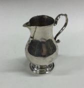 A Georgian silver pitcher cream jug of typical for