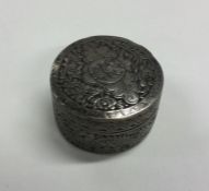 A Chinese silver cylindrical box decorated with dr