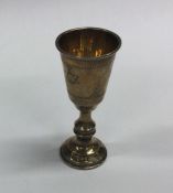 A silver gilt Kiddush cup. London. By AT. Approx.