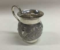 A good quality Indian silver mug decorated with el