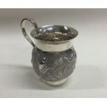 A good quality Indian silver mug decorated with el