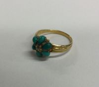 An 18 carat gold turquoise and rose diamond cluste