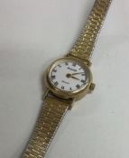 A lady's 9 carat Accurist wristwatch on gilt strap