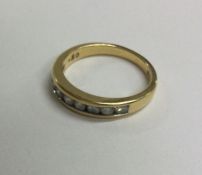 A good diamond half eternity ring in 18 carat gold