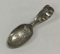 A silver 'This Little Piggy Went To Market' spoon.