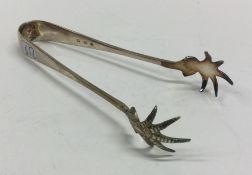 A good pair of heavy cast silver ice tongs. London