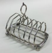 A heavy seven bar silver toast rack / smartphone d