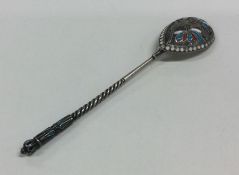 A Russian silver and enamelled spoon with twisted