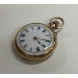 A small 9 carat fob watch with white enamelled dia