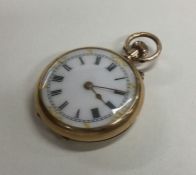 A small 9 carat fob watch with white enamelled dia